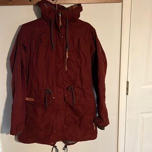 Columbia Outerwear red jacket with pockets and cinching details.